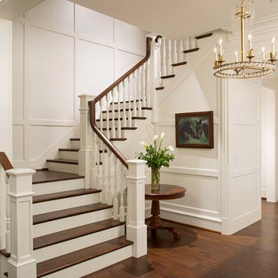 Stairwell with Colonial style moulding on walls 