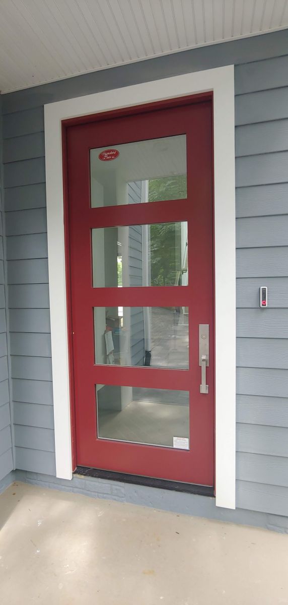 Custom red exterior door of modern home