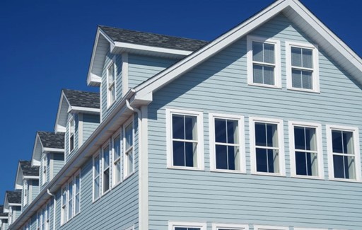 Exterior view of a house showcasing newly installed siding
