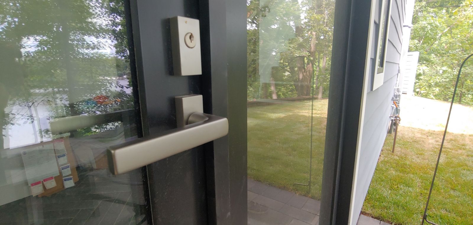 sleek bronze door handle on modern exterior door