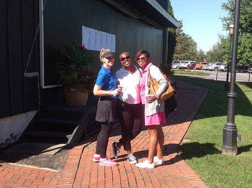 Three women pose by building at 29th Annual AIA Baltimore Golf Outing in Millersville, MD