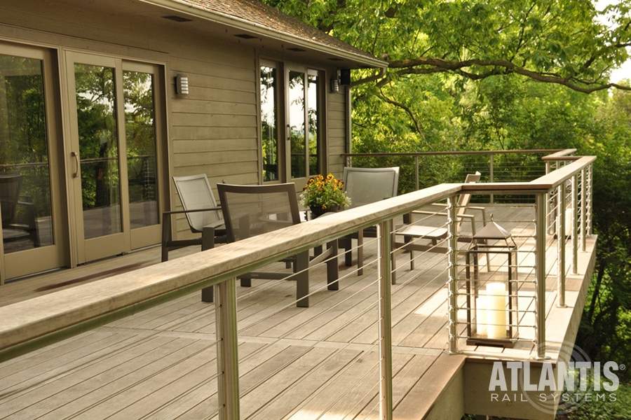 A deck featuring several chairs and tables arranged for outdoor seating in Raleigh, NC