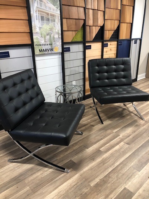 Two black leather chairs in a wood-paneled room near Millersville, MD