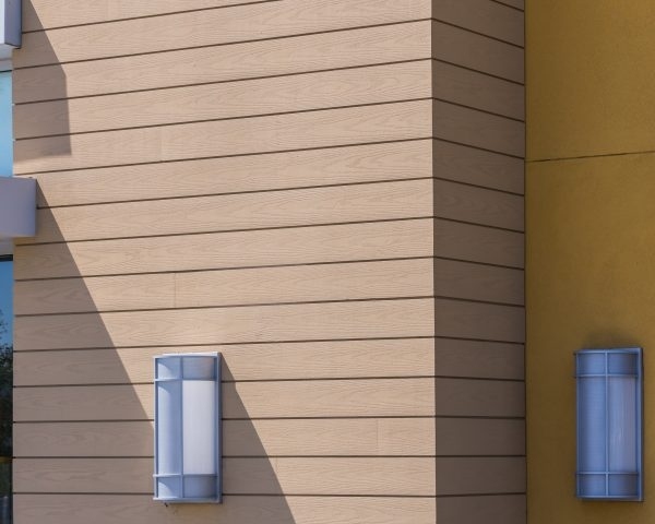 Building with Channel Siding, two light fixtures, and greenery in Millersville & Baltimore, MD