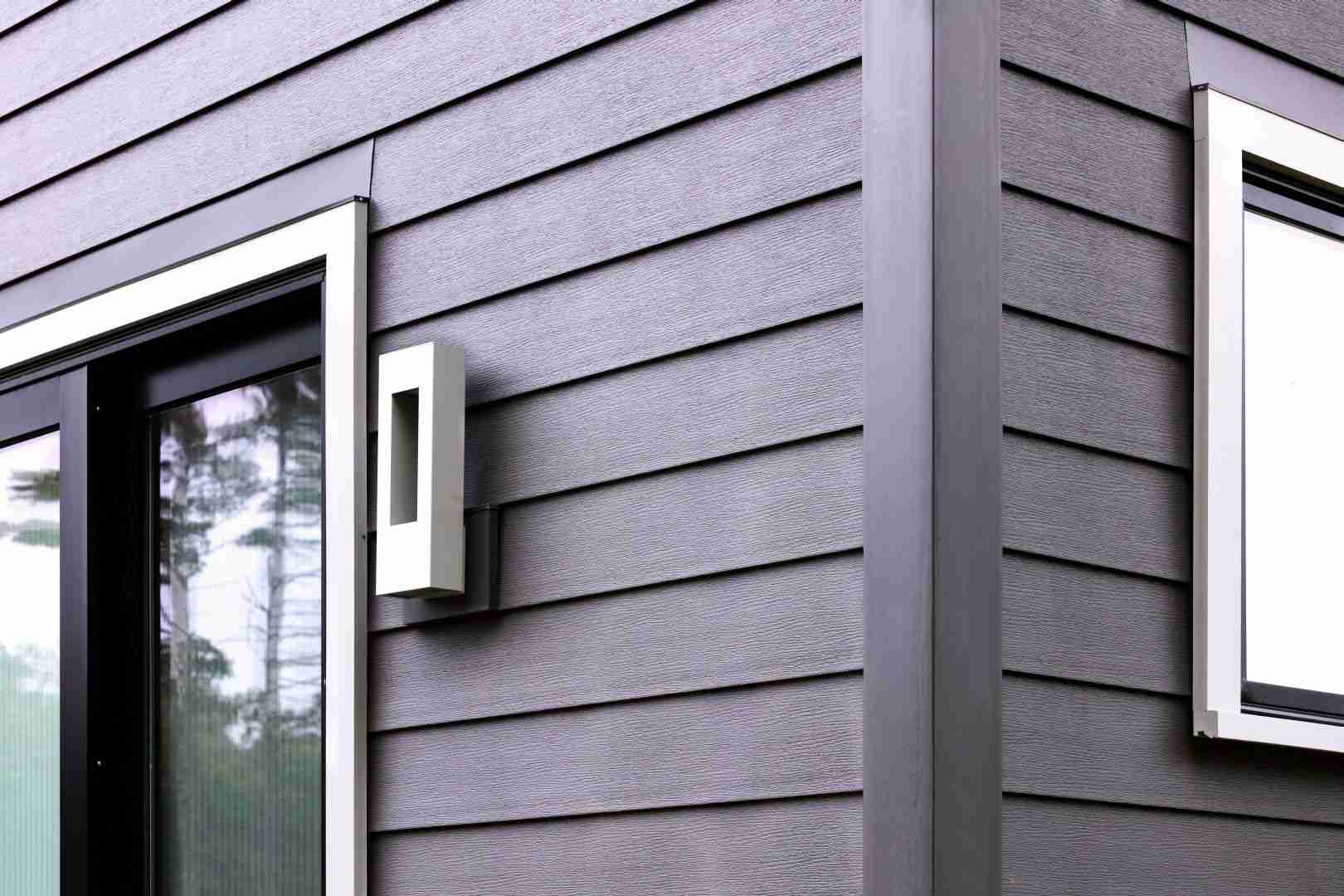 Close-up of a house window showcasing siding and roofing in Millersville and Baltimore, MD.