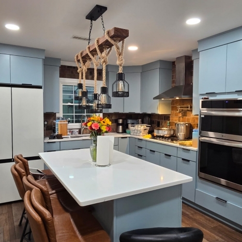 Contemporary Rustic Kitchen featuring blue cabinets and a white island in Millersville, MD