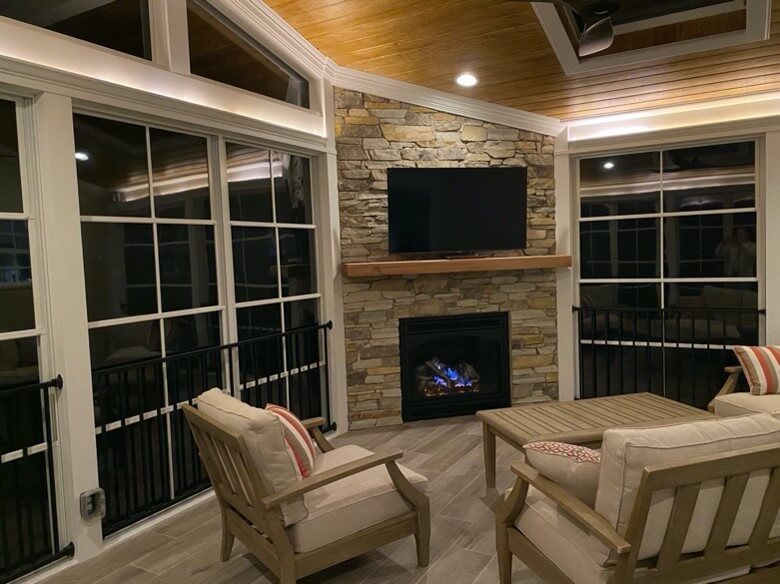Cozy sunroom with stone fireplace and TV in Millersville and Baltimore, MD