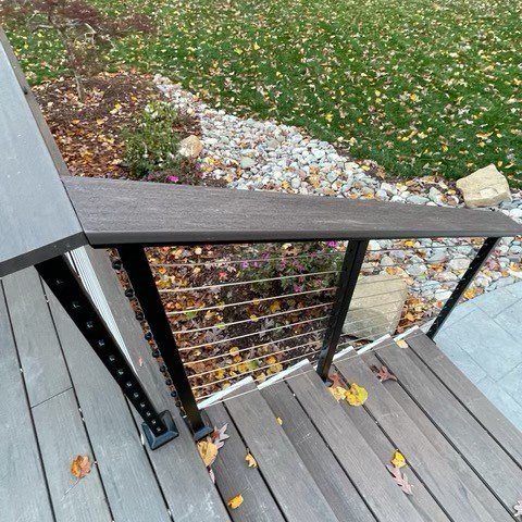 TimberTech deck stairs with Atlantis cable railing installed by Positive Bearing Construction