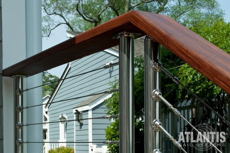 Deck railing featuring a metal frame and wooden handrail in Millersville and Baltimore, MD
