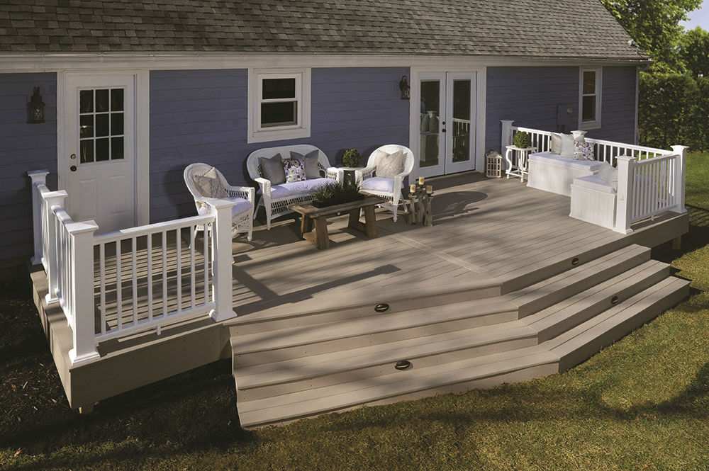 A deck with white furniture in front of a house, located in Millersville and Baltimore, MD