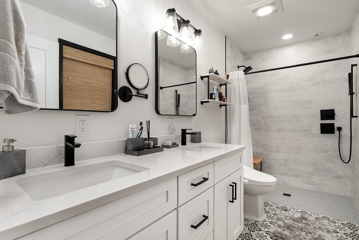 • Bright bathroom with double vanity, walk-in shower and modern fixtures