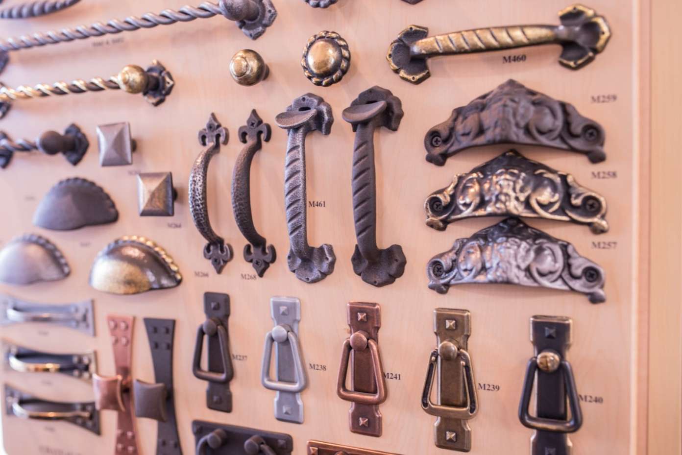A selection of antique brass hardware for cabinets, artistically arranged in Baltimore, MD
