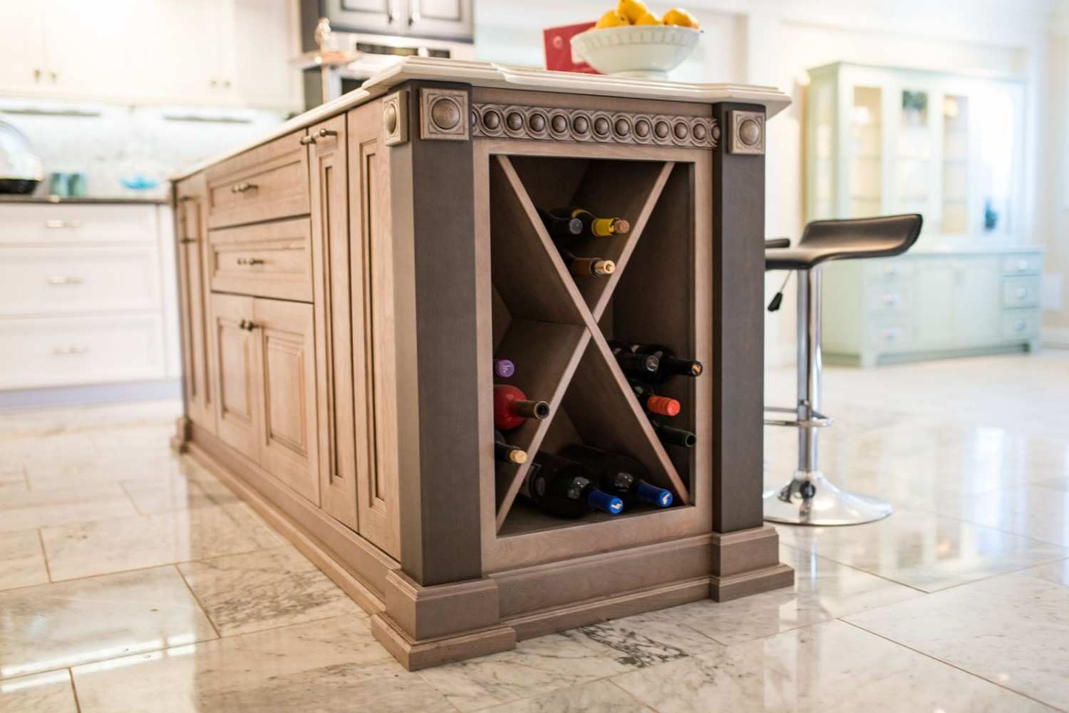 Kitchen showroom cabinets with integrated lighting and stone countertops