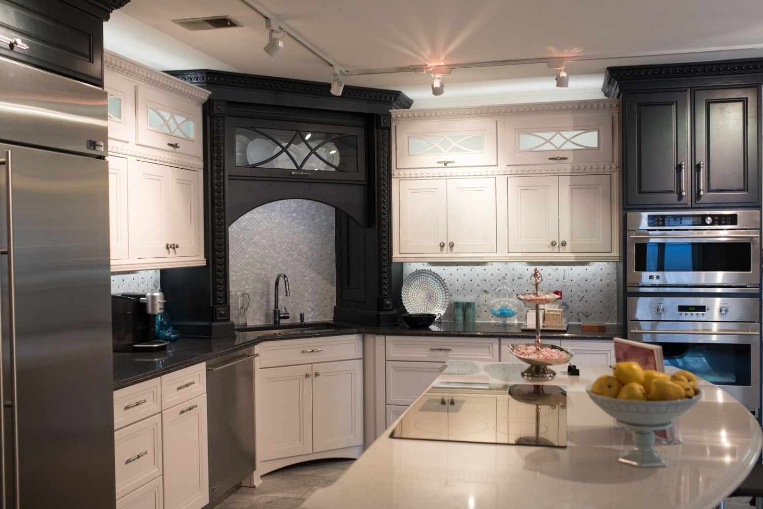 Kitchen island showroom display featuring built‑in wine storage