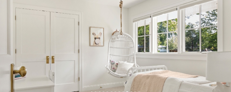Bright bedroom featuring Marvin Elevate windows with expansive views and daylight