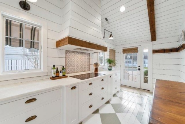 new kitchen installation project with white cabinets and countertops