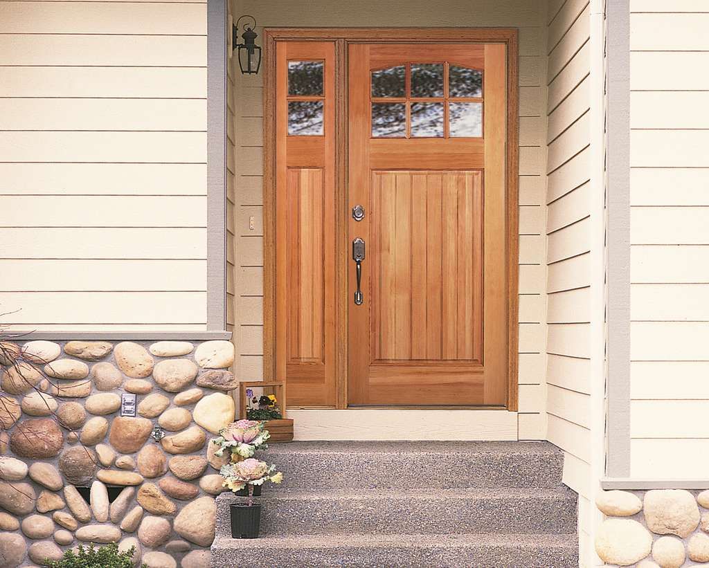 Wooden door in stone wall showcasing fouge valley doors in Millersville and Baltimore, MD