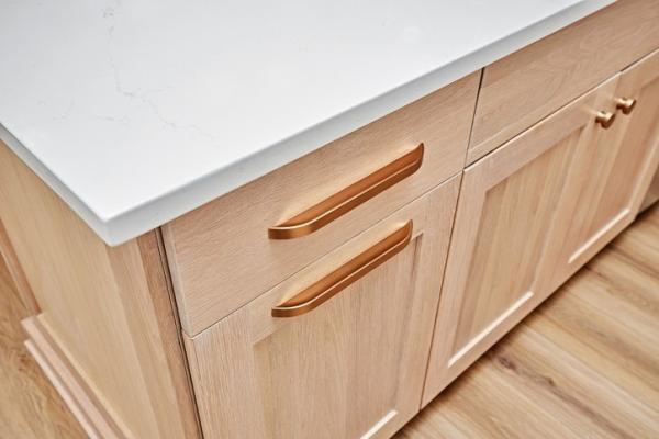 Close up of custom wood cabinetry hardware and finishes by American Cedar & Millwork
