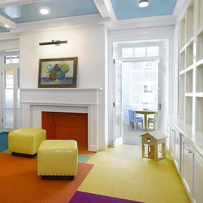 White interior moulding with ceiling beams and decorative fireplace