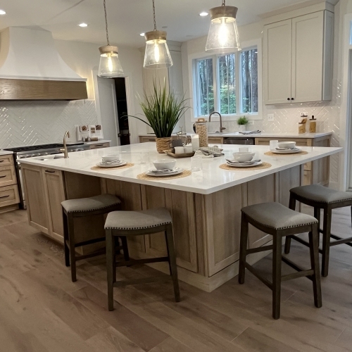 Transitional Design Kitchen featuring a center island and bar stools in Millersville, MD