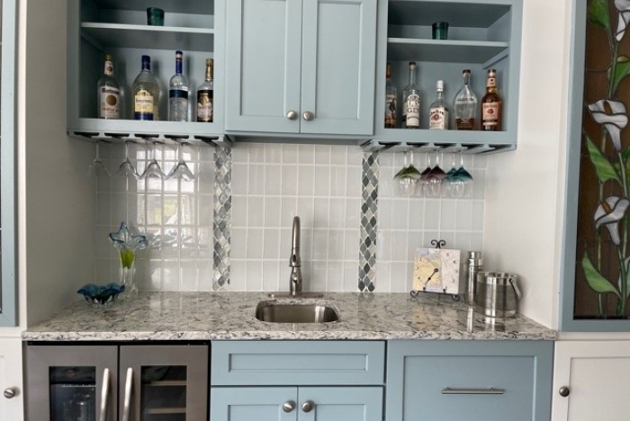 Wet Bar with blue cabinets and a sink in a Delaware kitchen setting