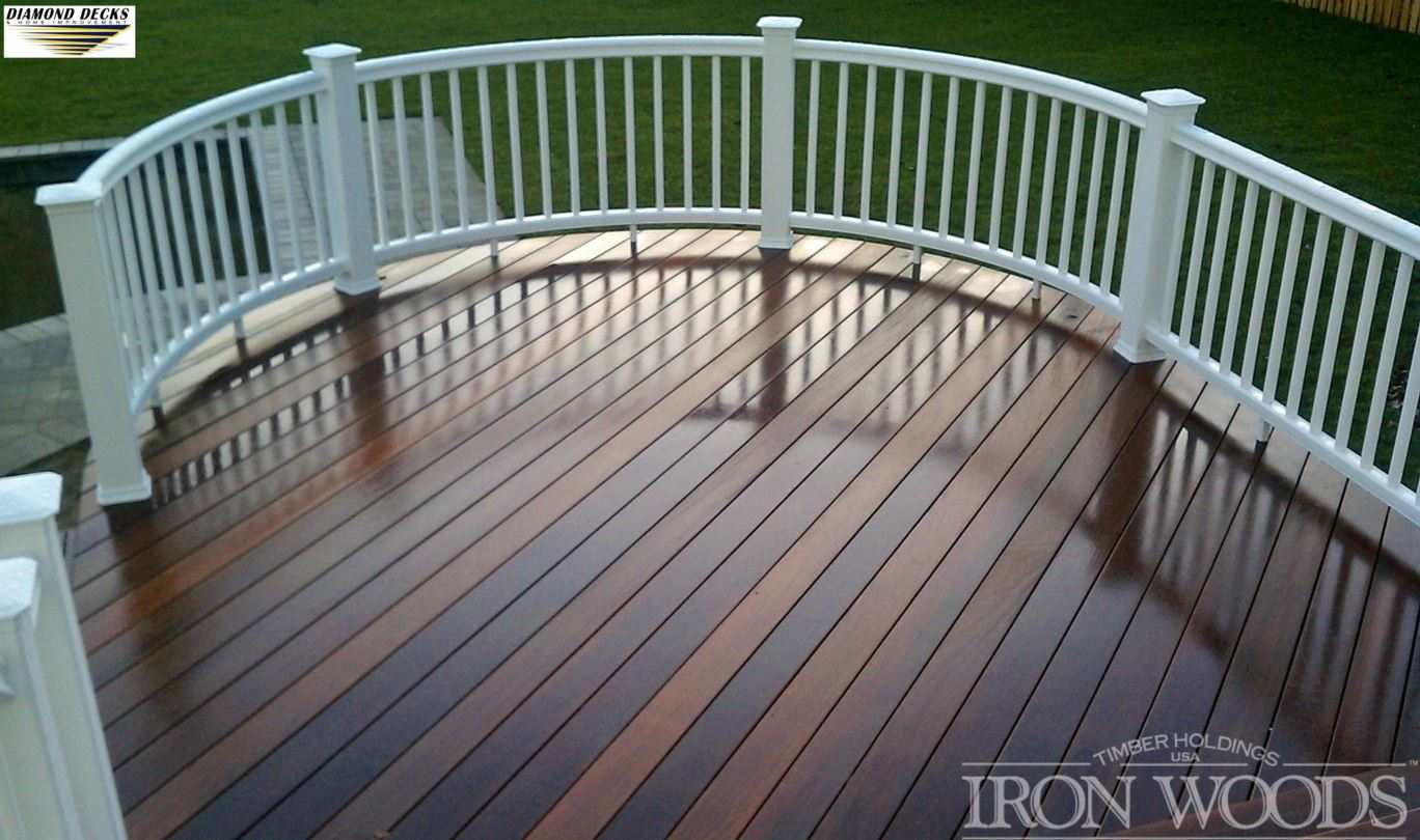 A well-maintained wooden deck featuring white railings, located in Millersville and Baltimore, MD